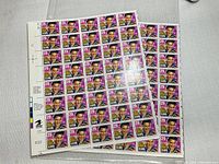 Two plate blocks of Elvis Presley stamps, each with 40 stamps at 29 cents denomination, featuring a colorful portrait of Elvis Presley in mint unused condition.