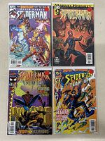 Photo of four Spider-Man comic books including Marvel Knights and Spider-Man Unlimited issues