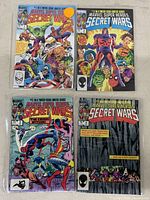 Photo showing Marvel Super Heroes Secret Wars comic books #1 through #4, each with colorful, detailed cover art featuring various Marvel characters.