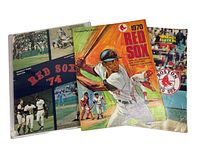 Three Boston Red Sox magazines and scoreboards from 1970, 1974, and 1979 arranged side-by-side showing various cover designs.