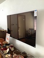 Front view of wall-mounted 58-inch Sony Bravia TV