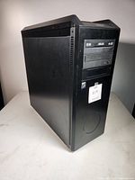 Front left view of black mid-tower showing brushed aluminum side panel and 5.25" bays