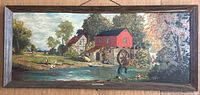 Photo of the large framed print depicting a pastoral mill scene with overpainting, showing the artwork in full view hanging on a wall.