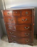 High bureau with six drawers, curved fronts, and ornate original drawer hardware