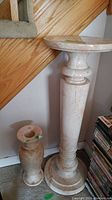 Front view of both stone pedestal and vase together