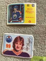 Photo showing the Wayne Gretzky 1981-82 NHL goal leader trading card above the cloth patch featuring Gretzky in Oilers jersey with number 99 and signature.