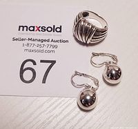 Sterling silver ball drop earrings shown with auction flyer