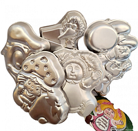 Stack of four Wilton character cake pans showing various characters including bird-like, mushroom hat character, and balloon character