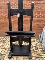 Front view of the easel TV stand without cover showing full structure.