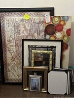 Full lot view showing all the frames including Paris map print and abstract art print