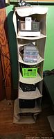 Full view of beige hanging 6-cube organizer showing shelves filled with electronic components and storage boxes.