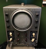 Front view of the Jackson CRO-2 oscilloscope, showing control knobs and central cathode ray tube screen.