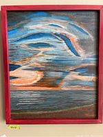 Full view of the signed painting framed in red wood, showcasing abstract seascape with cloudy sky and water.