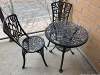 Three-piece set on balcony: one table and two chairs