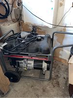 Front-left view showing steel frame, engine, alternator and wheel