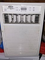 Front view of the white Whirlpool window air conditioner showing vent and controls.