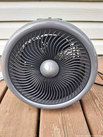 Close-up front view of the Noma fan heater showing detailed circular grille and visible fan blades inside.