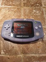 Game Boy Advance powered on showing Pokémon Ruby screen