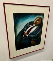 Framed oil painting on board showing a beaver with cigar, signature visible.