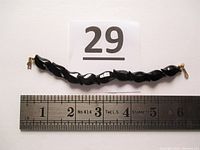 Top view of full bracelet with ruler showing length about 6 inches