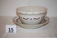 Two pottery bowls stacked showing red, white, and blue stars and stripes design