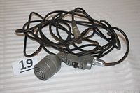 Full view of the Electro-Voice Model 630 microphone with attached long cable, showing connectors and the microphone body.