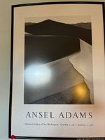 Ansel Adams framed black and white desert landscape photo with information about National Gallery of Art Washington exhibit dates printed below the title.