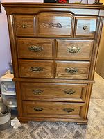 Front view of Broyhill dresser showing 6 drawers, 2 small top drawers, 4 larger below, with ornate handles and knobs.