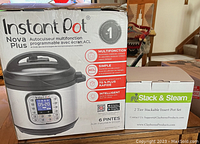 Photo of Instant Pot Nova Plus box next to Stack & Steam 2 Tier Insert Pot Set box
