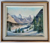 Framed oil painting showing overall landscape scene with snow and mountains, signed K. Long lower right.