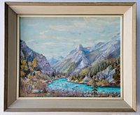 Framed landscape oil painting showing mountain valley with blue river and trees