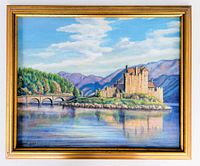 Framed oil painting depicting a castle on an island with a stone bridge to the left across water, mountains in background, signed lower left.