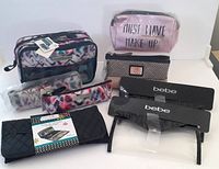 Full view of all 8 bags including 7 makeup/brush bags and 1 jewelry roll. New with tags.