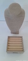 Full view of beige fabric-covered necklace bust and ring tray display items on a white background.