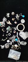 Full assortment of assorted jewelry on black background
