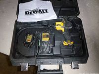 Overview of complete Dewalt inspection camera tool set inside black plastic carrying case with manual and charger.