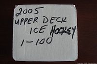 Top label of a box showing handwritten '2005 UPPER DECK ICE HOCKEY 1-100'