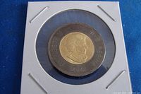 Obverse side of the 2022 Canadian $2 coin showing Queen Elizabeth II's effigy with black outer ring.
