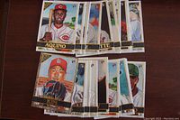 Multiple baseball rookie cards in mint condition laid out, showing player images and cards with RC logos.