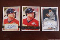 Photo showing two Jordan Luplow baseball cards—one autographed—and one Colby White autographed baseball card.