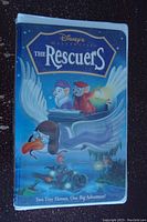 Front cover of factory sealed Disney VHS tape The Rescuers showing animated characters and title.