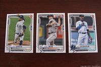 Three baseball rookie cards showing Deivi Garcia (NY Yankees), Casey Mize (Detroit Tigers), Jazz Chisholm (Miami Marlins) in mint condition.