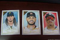 Three baseball insert cards displayed side by side: Chris Archer, George Springer Jr., Manny Machado