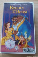 Front view of the VHS case showing colorful artwork of Beauty and the Beast characters on the cover.