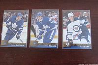 Front side of cards showing Auston Matthews, Mitch Marner, and Patrik Laine in NHL team jerseys with Top Rookies branding.