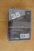 Photo of sealed package containing 35 Ultra PRO Top Loaders for cards.