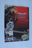 Front side of the 1992 SkyBox Shaquille O'Neal rookie card showing Shaq dunking in Orlando Magic uniform with the SkyBox logo and rookie insignia.