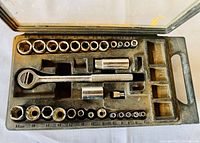 Top view of Mastercraft ratchet and sockets set in open plastic case showing ratchet handle, sockets arranged by size, and extension pieces