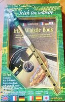 Clear view of Walton's Irish tin whistle in original packaging along with instruction book and demonstration CD.