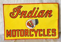 Front view of the rectangular yellow metal sign with "Indian Motorcycles" text and Native American chief logo.